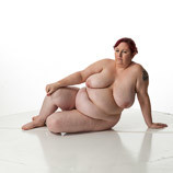 360 degree rotatable view of a full-figured nude female art model in a sitting art reference pose