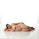 Art reference photos of a full figured nude female in a reclining pose
