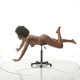 Nude African-American female in a flying pose for sculpture and painting reference