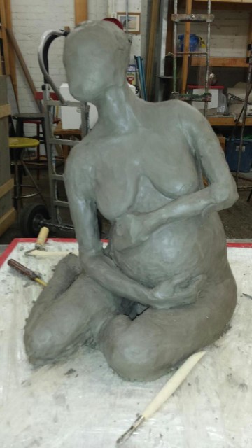 Sculpture by Central Illinois artist Nicki Freeman Griner showing a seated pregnant woman based on ArtModels360 pose Renee 024