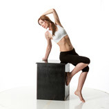 360 degree rotatable images of a female artist's figure dressed in yoga pants and sports bra model sitting on the edge of a box