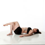 360 degree rotatable images of a female artist's figure model dressed in yoga pants and sports bra laying on her back