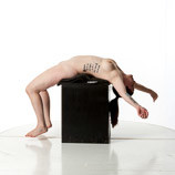 360 degree rotatable images of a nude female artist's figure model with a real woman build laying on her back on a box