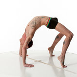 360 degree rotatable images of a slim male art figure model doing a backbend