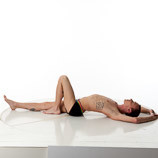 360 degree rotatable images of a slim male art figure model laying on the floor