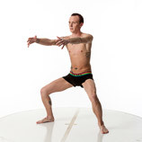 360 degree photos of a slim male art figure model standing with his knees bent