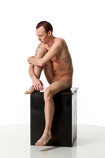 360 degree photos of a slim nude male art figure model sitting on a box