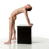 360 degree photos of a slim nude male art figure model standing and leaning backward onto a box