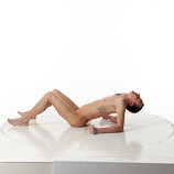360 degree photos of a slim nude male art figure model laying on the floor