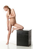360 degree rotatable images of a nude female art model standing with one knee up on a box