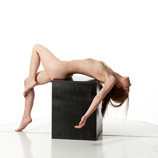360 degree rotatable images of a nude female artist's figure model laying on her back on a box