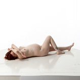 360 degree artist reference photos of a nude 7 months pregnant female figure model posed laying on the floor for sculpture and painting reference