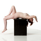 360 degree artist reference photos of a nude 7 months pregnant female figure model posed laying on a box posed for sculpture and painting reference
