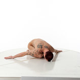 360 degree artist reference photos of a slim nude male art figure model kneeling bent over with his head on the floor
