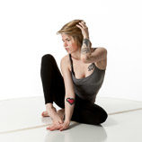 Artist reference photos of a slim blond female art model in a sitting pose