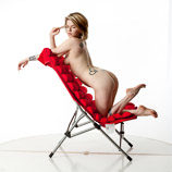 360 degree rotatable artist reference photos of a slim nude blond female art model posed with a sling chair