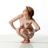 360 degree rotatable artist reference photos of a slim nude blond female art model posed on the floor