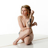 360 degree rotatable artist reference photos of a slim nude blond female art model posed on the floor