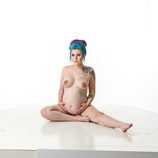 Nude 360 degree art reference photos of a pregnant woman posed for figure artists