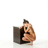 Nude 360 degree art reference photos of a slim dark haired female art model for use by figure artists and art students